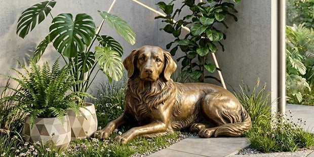 Bronze dog sculpture placed in a landscaped garden showing outdoor sculpture scale and proportion