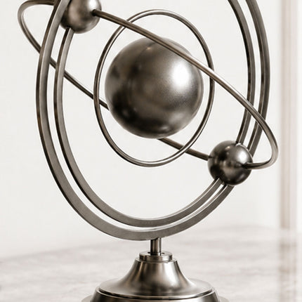 Close-up detail of geometric stainless steel sculpture showing precision crafted circular forms