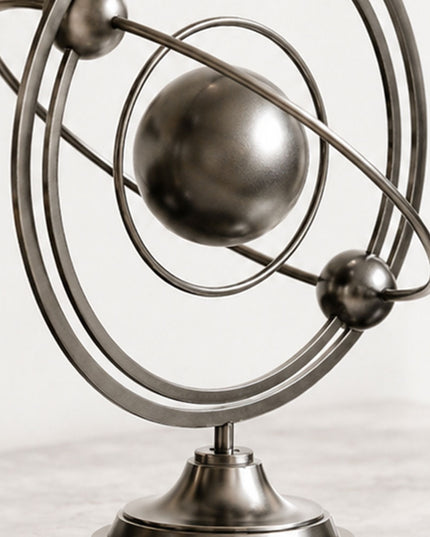 Close-up detail of geometric stainless steel sculpture showing precision crafted circular forms