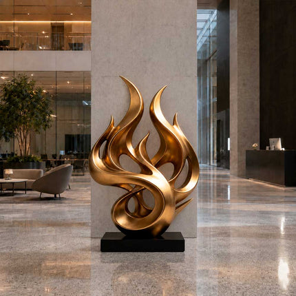 Gold flame inspired abstract sculpture in a contemporary luxury interior space