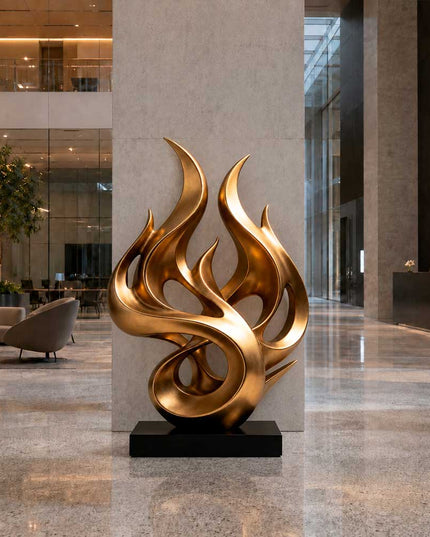 Gold flame inspired abstract sculpture in a contemporary luxury interior space