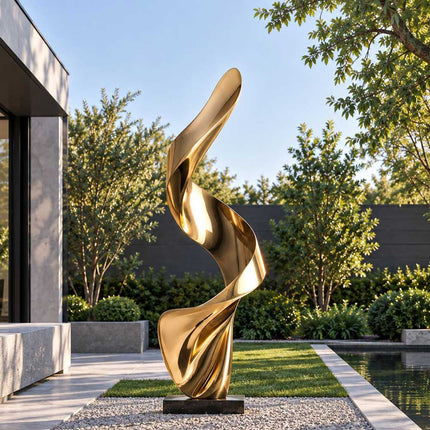 Gold abstract stainless steel sculpture with a twisting ribbon form in a modern private garden
