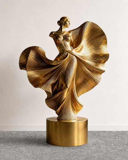 Gold electroplated stainless steel dancing woman sculpture with flowing textured details