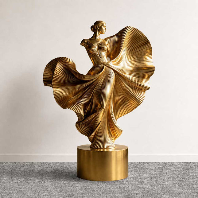Gold electroplated stainless steel dancing woman sculpture with flowing textured details