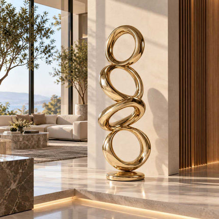 Gold mirror circular stainless steel sculpture in a contemporary interior