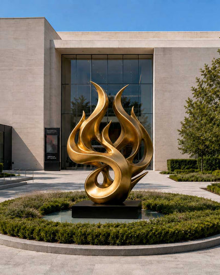 Gold stainless steel abstract sculpture displayed in a modern architectural landscape