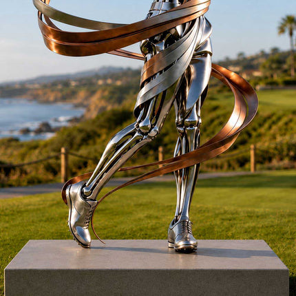 Close-up of golfer legs and flowing metallic ribbons in stainless steel sculpture