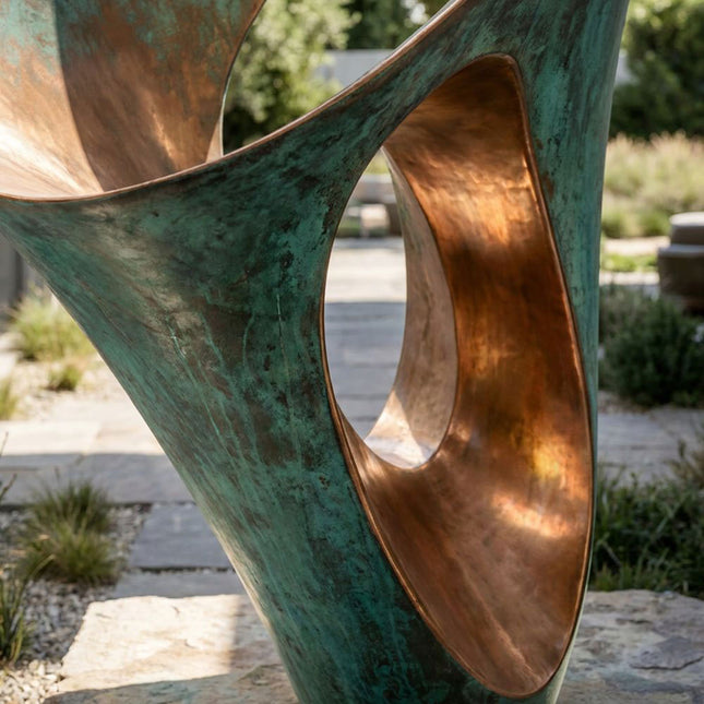 Close-up of bronze sculpture surface showing green patina texture