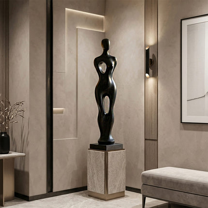 Close-up detail of handcrafted stainless steel sculpture with smooth black finish