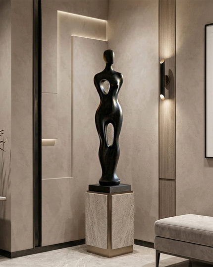 Close-up detail of handcrafted stainless steel sculpture with smooth black finish