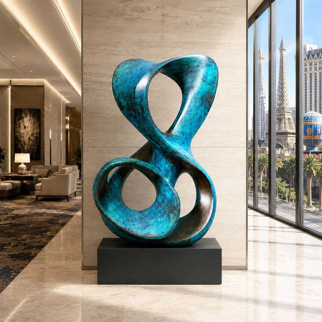 Patinated bronze abstract sculpture displayed in a contemporary luxury interior space