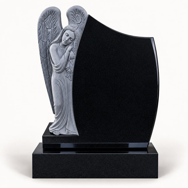 Black granite leaning angel headstone with carved wings and polished memorial panel