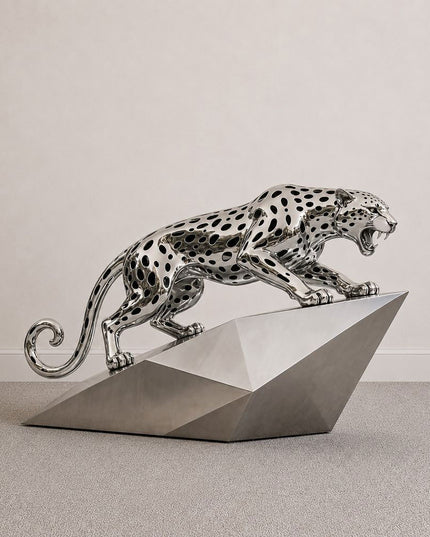 Modern stainless steel leopard animal sculpture with dynamic pose and polished surface