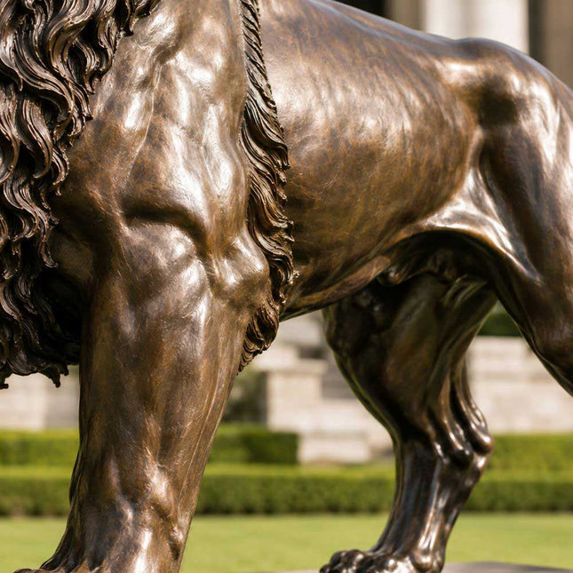 Bronze lion sculpture detail showing muscular anatomy and warm brown patina