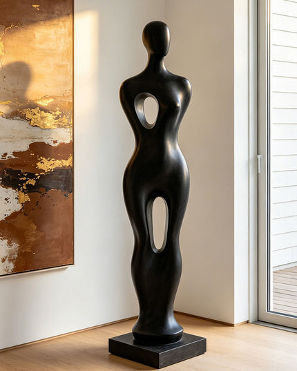 Black abstract sculpture in a modern interior setting with abstract painting and sliding door.