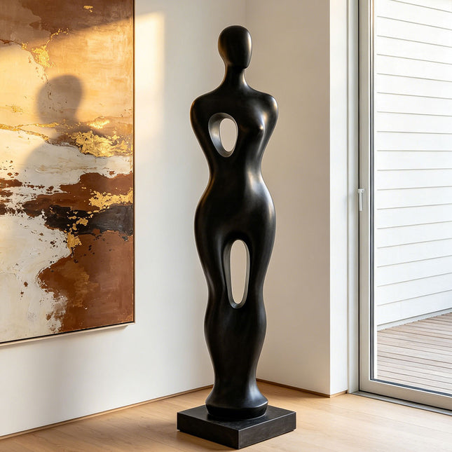 Black abstract sculpture in a modern interior setting with abstract painting and sliding door.