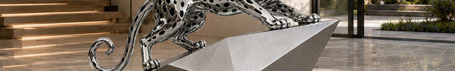 Contemporary animal sculpture displayed in a luxury architectural interior space with modern residential design.