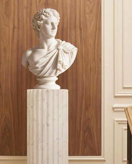 Marble bust sculpture displayed in a refined luxury interior space