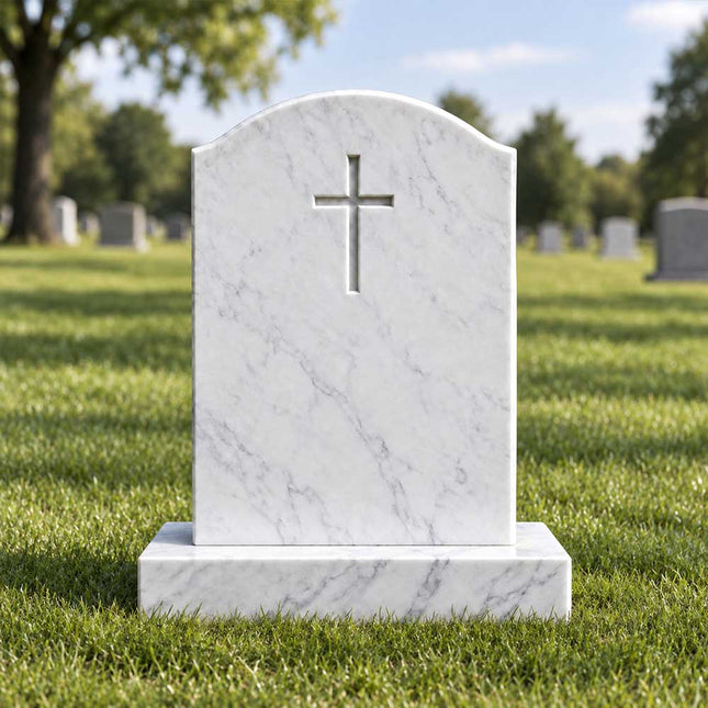 White marble cross headstone with a gently curved top and rectangular base displayed in a grassy cemetery