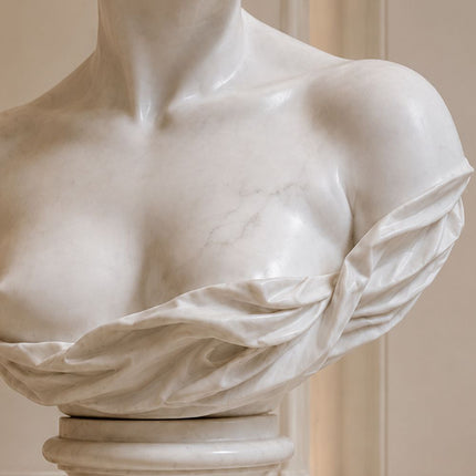 Detailed marble carving of classical female sculpture drapery