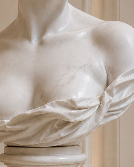 Detailed marble carving of classical female sculpture drapery