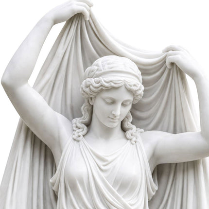 Close-up of the carved face, curled hair, hands, and raised drapery on a marble female statue