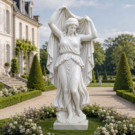 Marble female statue with raised drapery displayed in a formal residential garden