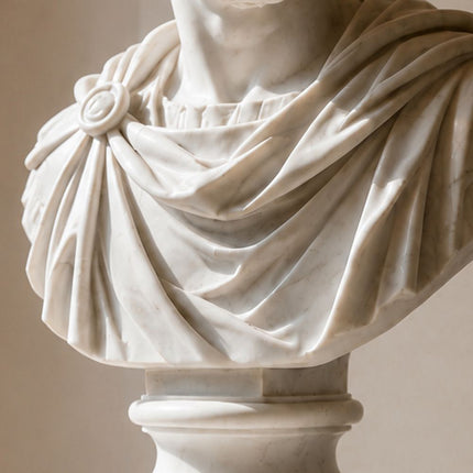 Detailed marble carving of classical drapery and sculptural texture
