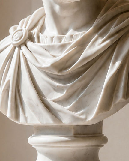 Detailed marble carving of classical drapery and sculptural texture