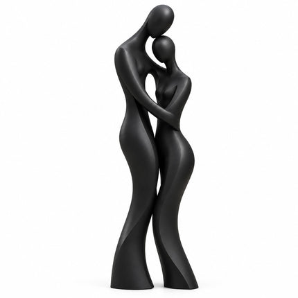 Matte black bronze sculpture of two elongated abstract figures embracing on a white background