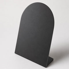 Matte black finish with a smooth non-reflective surface for contemporary bronze sculptures.