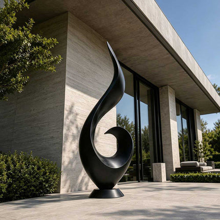 Matte black stainless steel abstract sculpture displayed in a modern architectural exterior setting