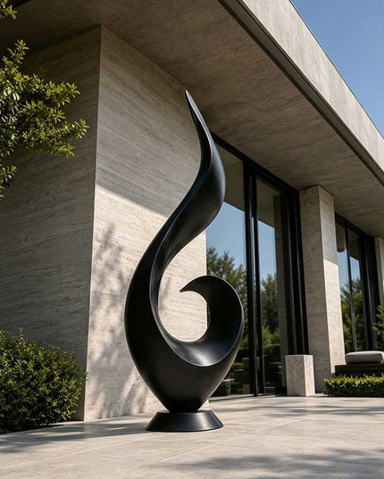 Matte black stainless steel abstract sculpture displayed in a modern architectural exterior setting