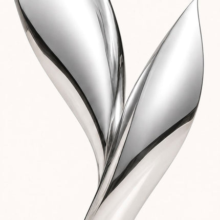 Close-up of curved leaf-inspired forms and reflective mirror polished stainless steel surface