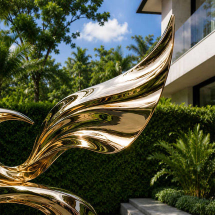 Close-up detail of reflective stainless steel surface and flowing sculptural curves