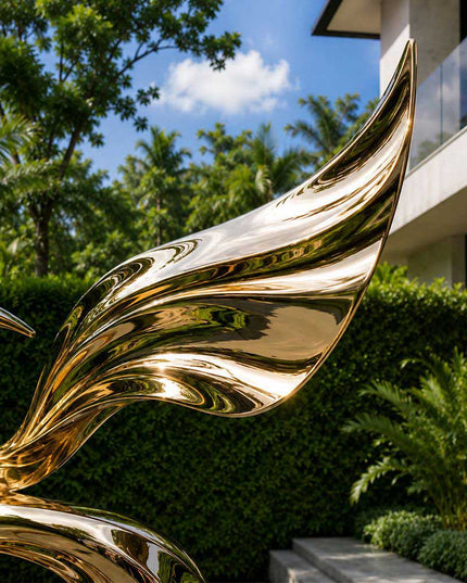Close-up detail of reflective stainless steel surface and flowing sculptural curves