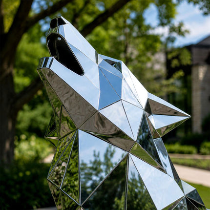 Mirror polished stainless steel surface detail of wolf sculpture