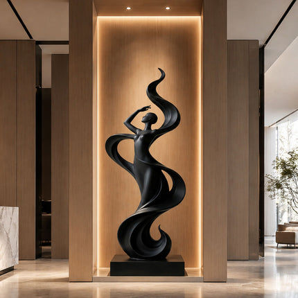 Modern black stainless steel sculpture installed in a contemporary architectural interior