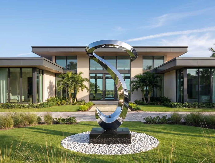 Modern contemporary stainless steel sculpture in a luxury architectural landscape