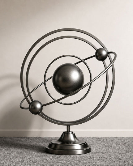Modern geometric stainless steel sculpture displayed as a contemporary interior art piece