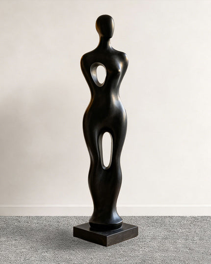 Abstract figure sculpture displayed in a modern luxury living room interior