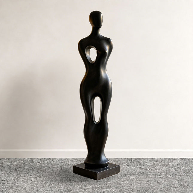 Abstract figure sculpture displayed in a modern luxury living room interior