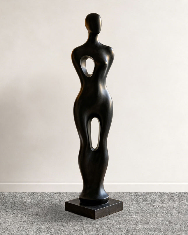 Abstract figure sculpture displayed in a modern luxury living room interior