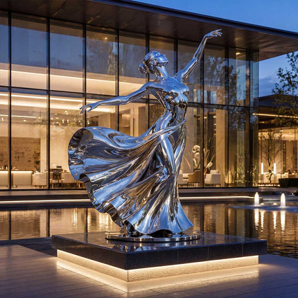 Mirror polished stainless steel sculpture displayed beside modern architecture and water features