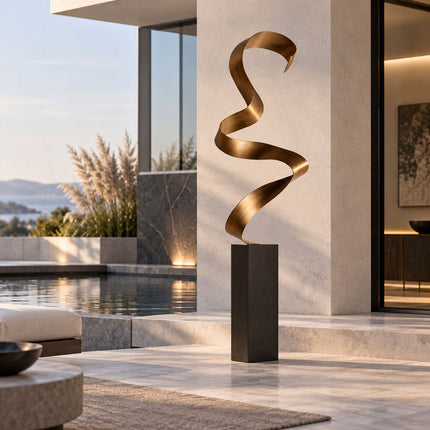 Modern stainless steel ribbon sculpture beside a contemporary residential pool