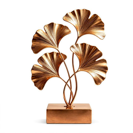 Organic ginkgo leaf sculpture crafted in gold stainless steel with flowing botanical forms