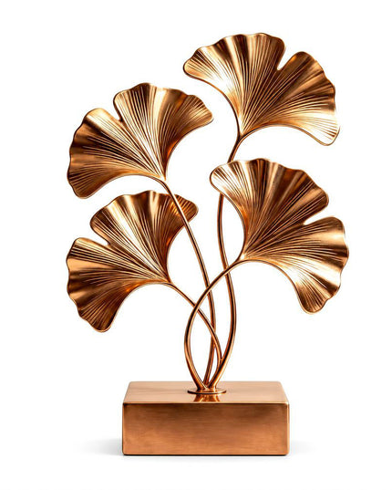 Organic ginkgo leaf sculpture crafted in gold stainless steel with flowing botanical forms