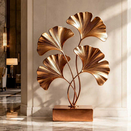 Organic metal sculpture featuring ginkgo inspired forms in a modern interior space