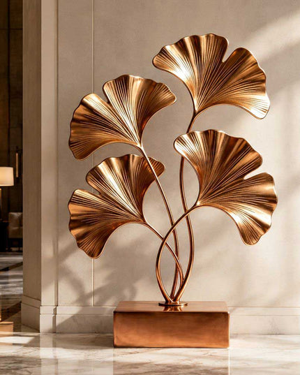 Organic metal sculpture featuring ginkgo inspired forms in a modern interior space