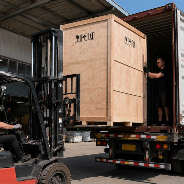 Wooden crate containing a large sculpture being loaded for international export shipping